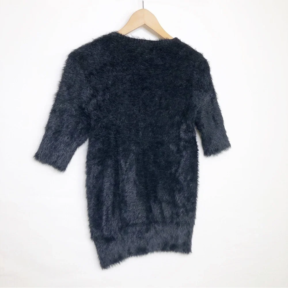 Knitted and knotted black, eyelash, scoop, neck sweater